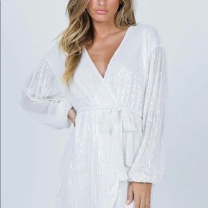White sequins dress never worn, hits about mid thigh and I’m 5’6